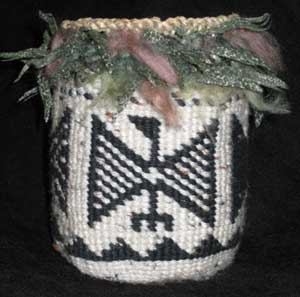 Sallybag with a condor design, trimed in goose feathers
